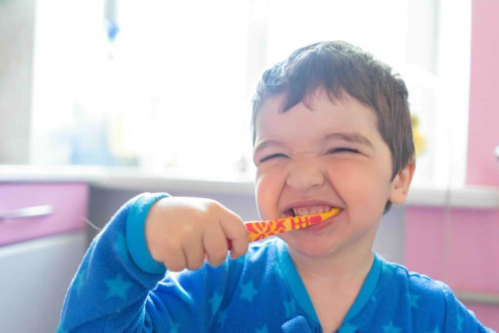 child brushing teeth regularly